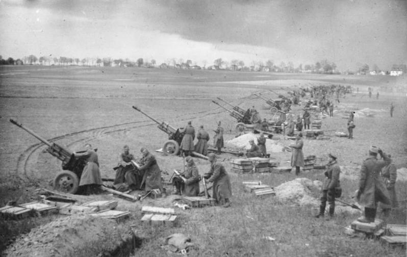 A long line of Soviet guns open fire