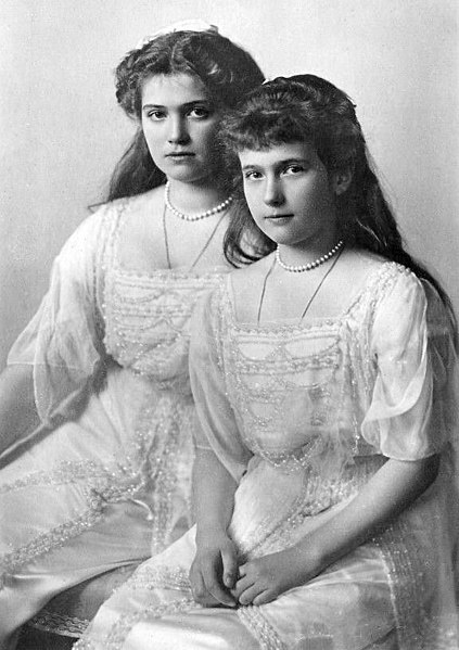 Maria and her younger sister Anastasia, both have the same dres and pearl necklace