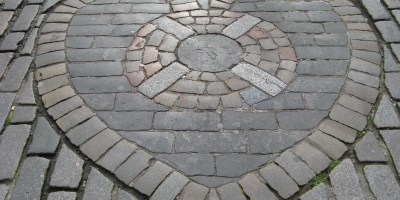 A mosaic of cobbles shaped like a heart