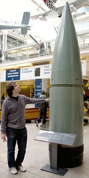 A man is dwarfed by the projectile, surpassing 3 metres at least