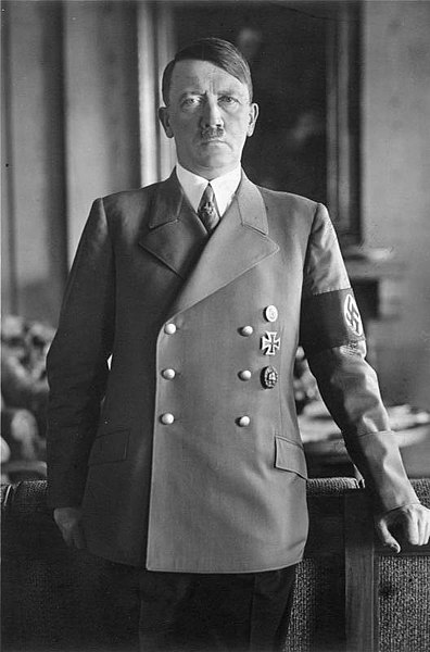 An official picture of Hitler with a stern look in the Reich's Chancellery